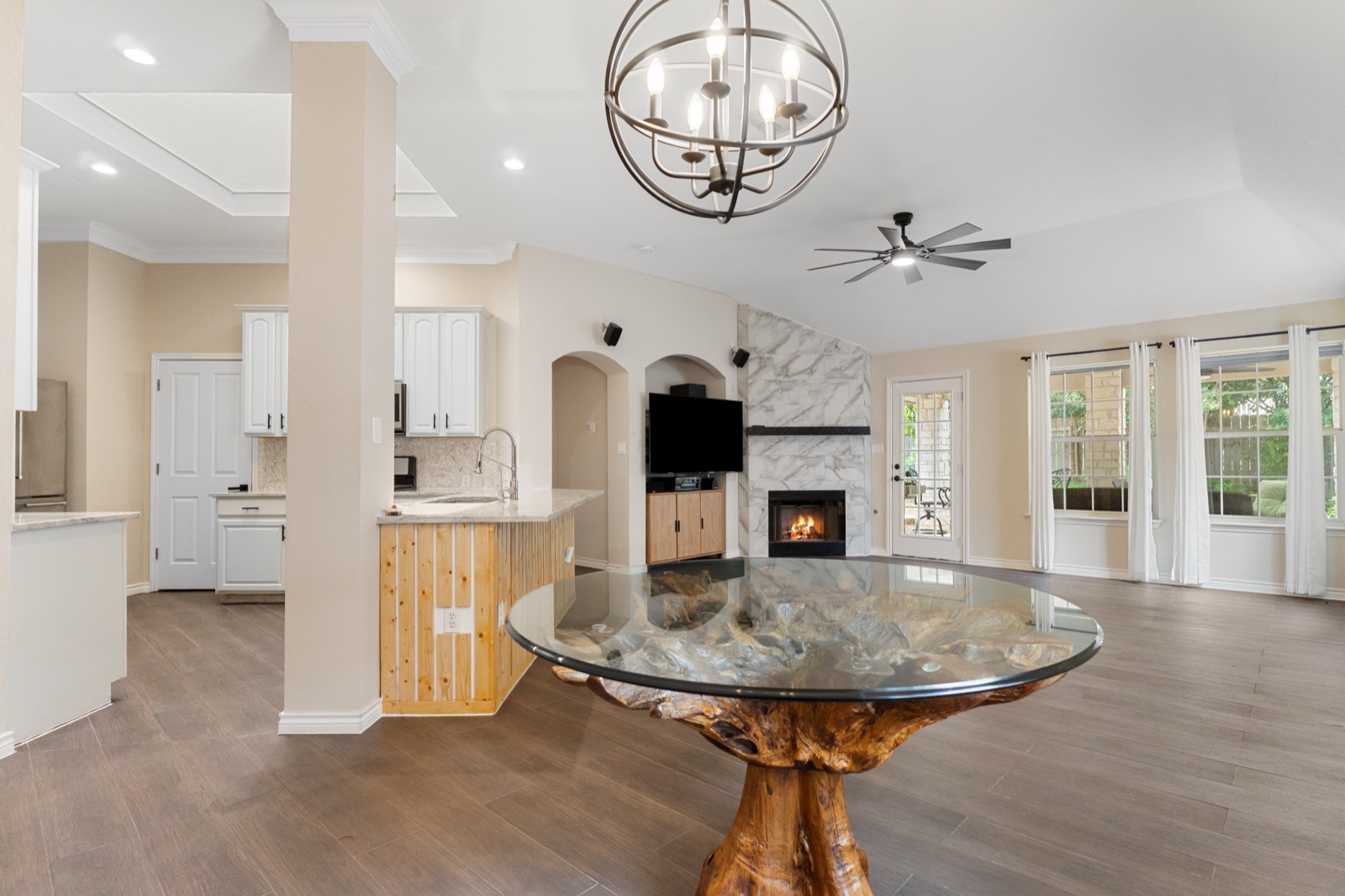 Living room with fireplace and dining area
