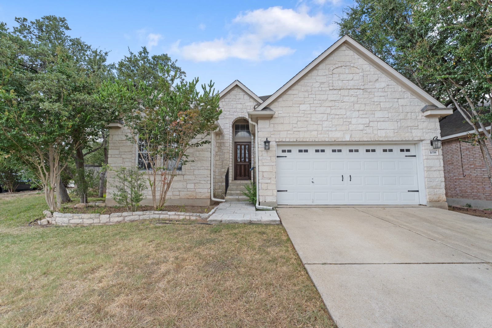 Stone home exterior with front entry