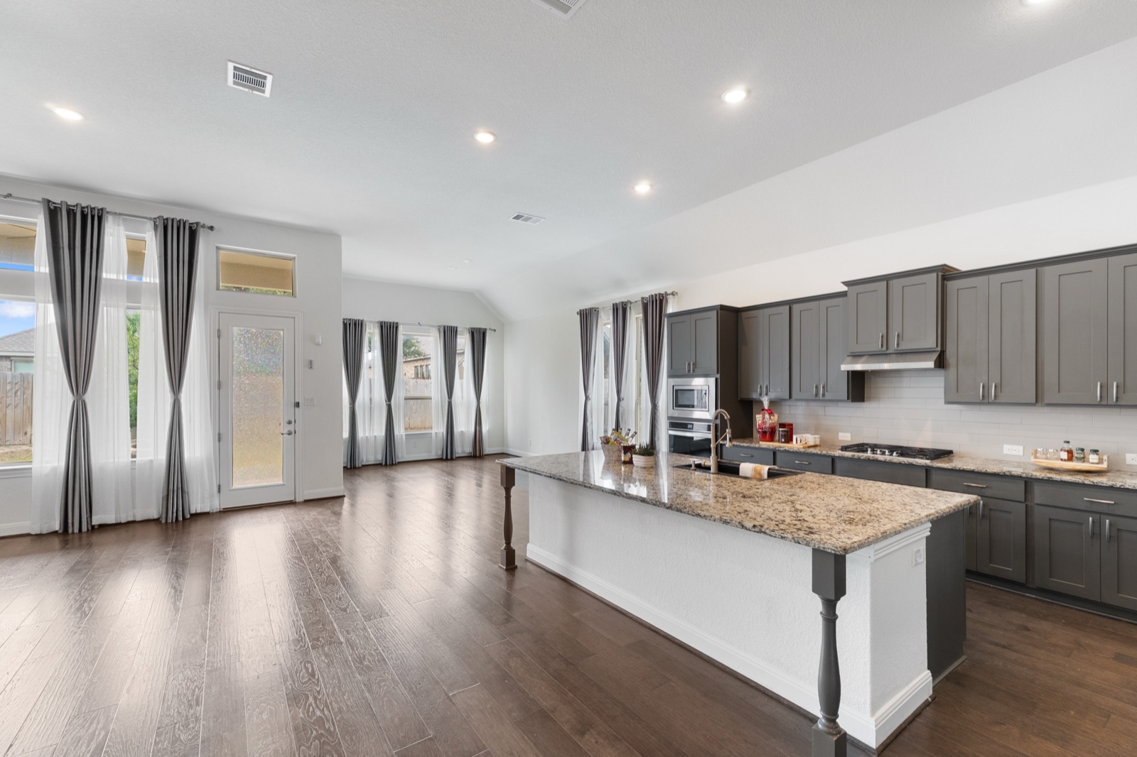 Bright gray kitchen with granite island